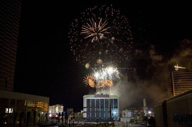 A fireworks show explodes over the New Frontier hotel tower before it is imploded in Las Vegas, Nevada November 13, 2007. The casino on The Las Vegas Strip was purchased by Elad properties, an Israeli-owned real estate investment group, for more than U.S. $1.2 billion in May 2007. Elad Group, which also owns the Plaza hotel in New York, and the IDB Group are expected to build a multi-billion dollar Plaza-themed megaresort themed on the site.